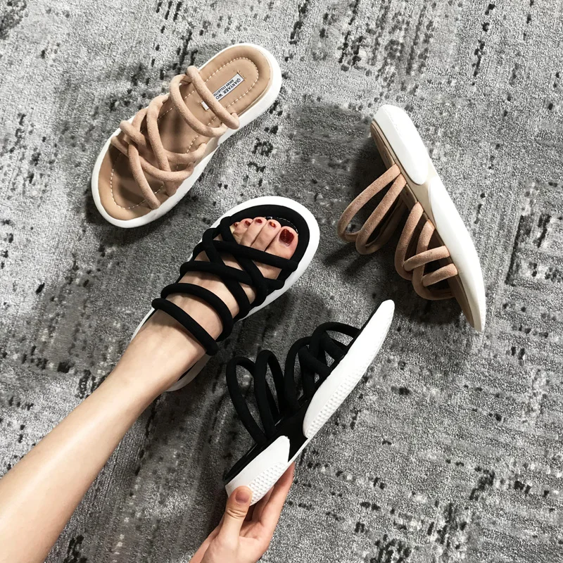 

A Pair Of Cool Sneakers And Two Women Wearing A Thick Bottom