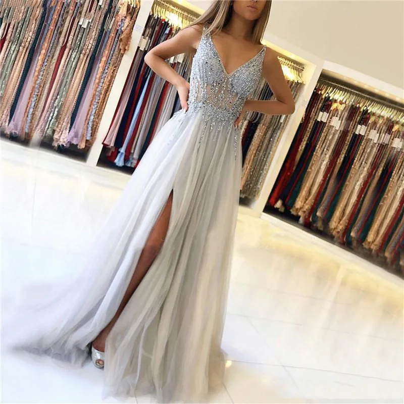 

Sparkly Silver 2019 Prom Dresses V-Neck Sequins Beaded See Through Sleeveless Girls Graduation Party Gowns With Side Slit Gala