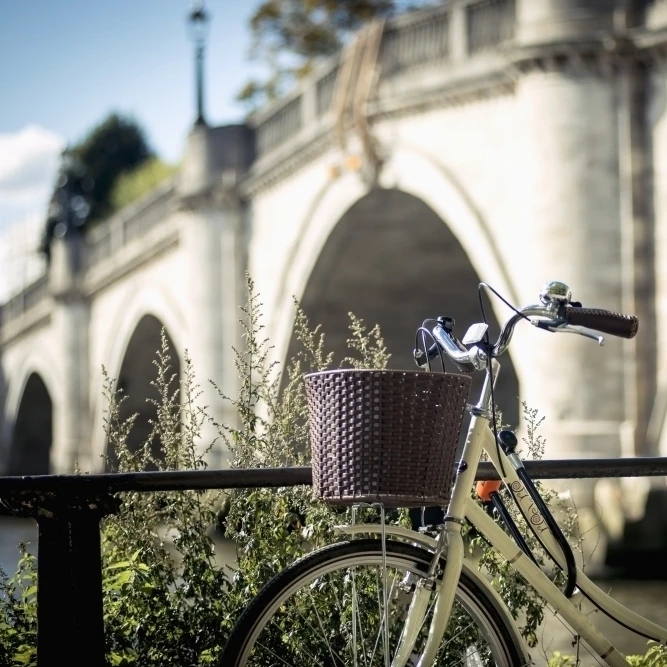 UK  England  Richmond; London  Richmond Park  Bicycle parked near Richmond Bridge Poster Print (19 x 12)