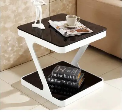 Simple modern tempered glass coffee table. Creative living room small side coffee table. Simple modern tempered glass coffee table. Creative living room small side coffee table.