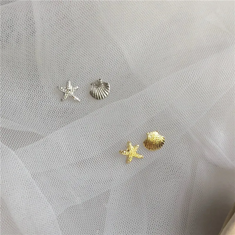 

S925 silver needle temperament simple shell sea star asymmetrical small ear nail