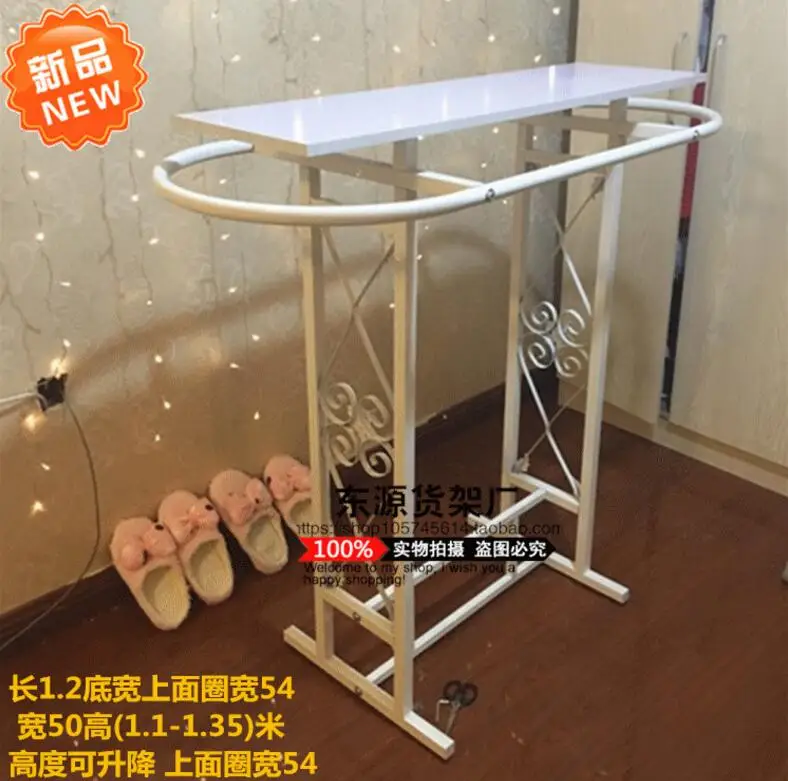 

High - grade iron art clothing store shelves display rack in the middle island frame of the children's wear ellipse.
