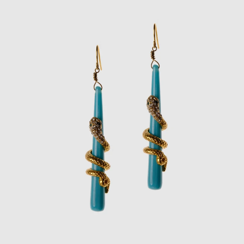 

Earrings are designed with a snake wrapped around a pendant on a branch