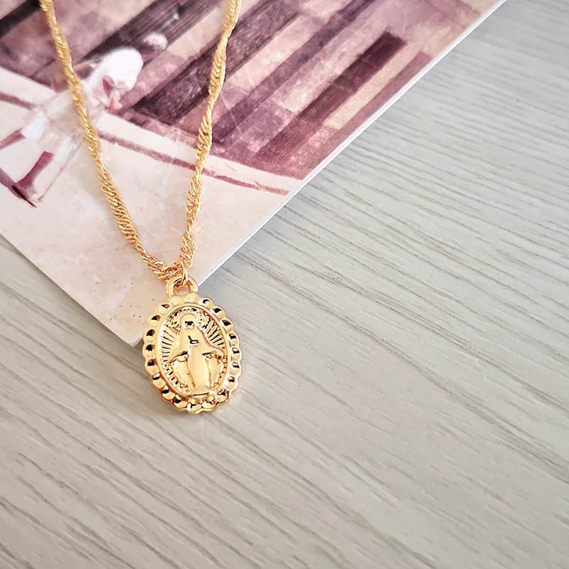 

Sleek minimalist portrait of the Virgin Mary necklace Double-sided coin cross-border pendant necklace