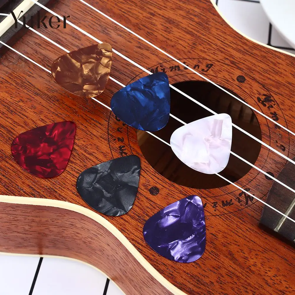 25pcs colorful 0.51/0.71/0.46mm thickness Guitar Picks Plectrums Celluloid Mediators Bass Guitar parts -