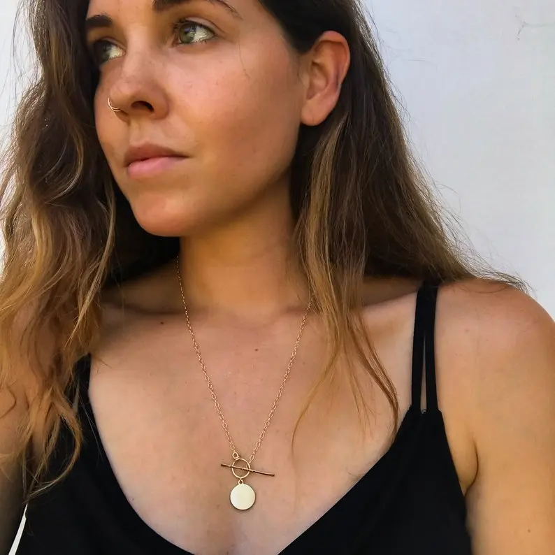 

Gold Evil eye necklace, gold coin front toggle clasp necklace