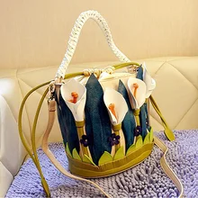 Feminina bolsa de hombro de la manera de cuero de las mujeres bolsos de diseño de alta calidad lirio personalidad bolsa de cubo bolsa de mensajero de las mujeres