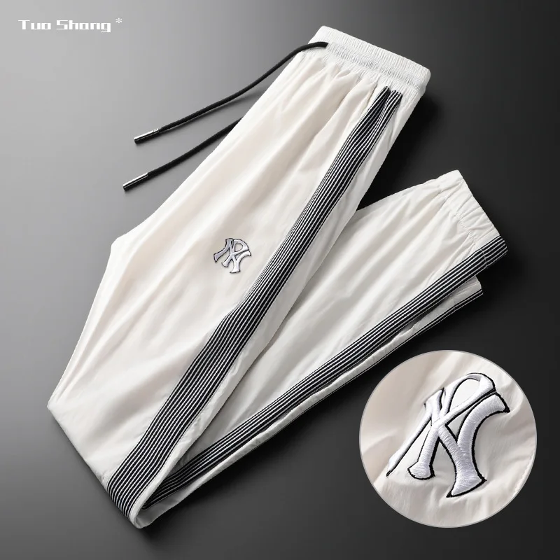 

Fashion Brand Light Luxury Men Slim Fit Pants Summer Top Sales Thin Ice Silk Smooth White Movement Casual Pants Homme