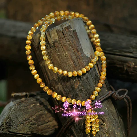 

Natural rutilated titanium crystal bracelet rutilated titanium crystal 108 beads bracelet garnet