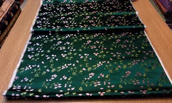 

chinese silk brocade woven damask damask fabric cheongsam cushion dark green back with gold seeds and pink leaf pattern