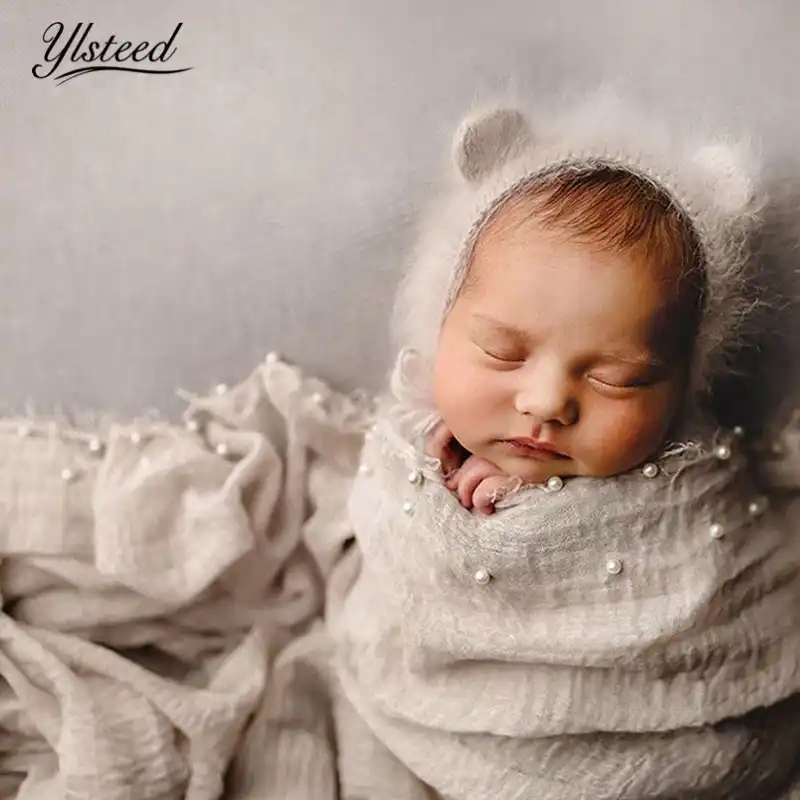 swaddle baby for photoshoot