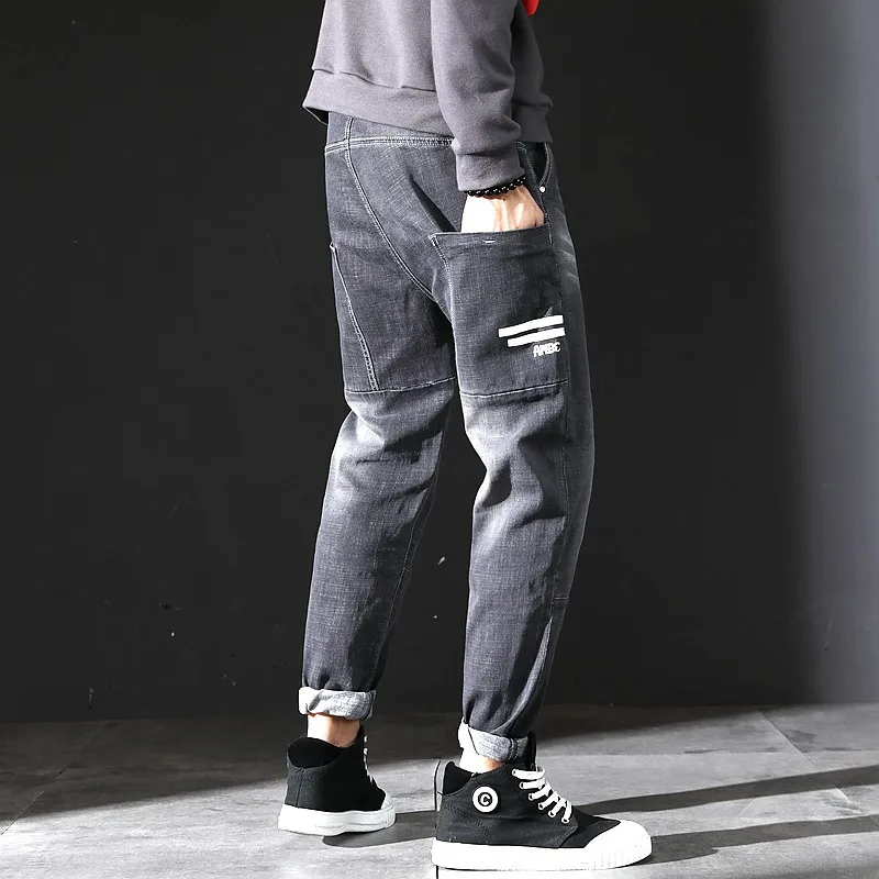 Большие размеры 40 мужские джинсы осень зима модный тренд камуфляж сшивание эластичные брюки из Харлана мужской бренд