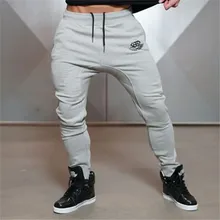 2017 NEUE MÄNNER GOLD JOGGER FITNESS HOSEN BEILÄUFIGE ELASTISCHE BAUMWOLLE HERREN FITNESS WORKOUT HOSEN DÜNNE SWEATPANTS HOSE JOGGER PANT