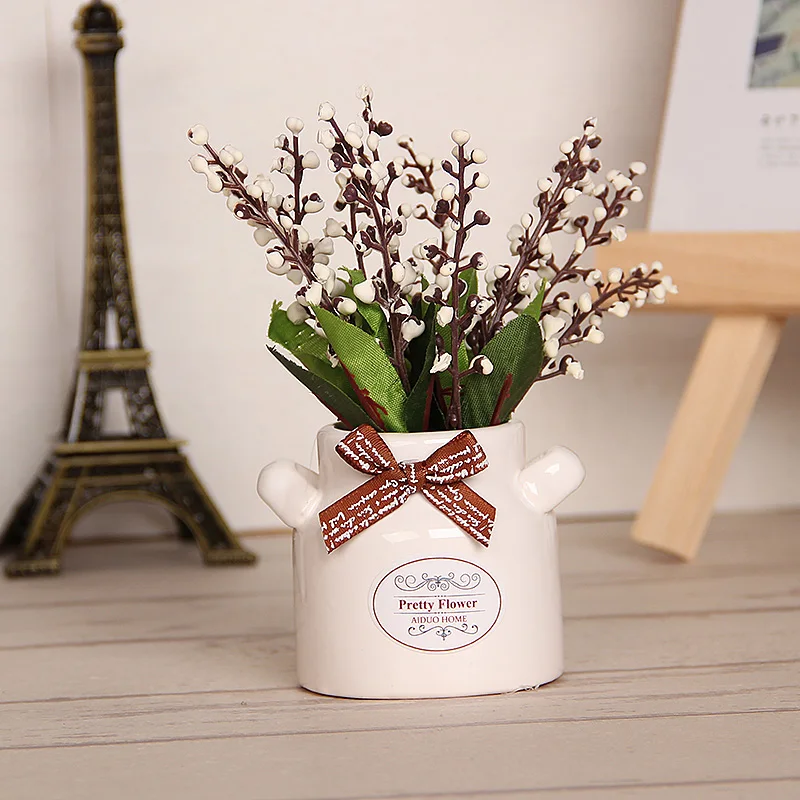 The office is decorated with potted plants small decorative items