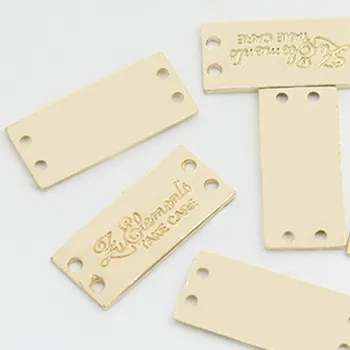 

Custom embossed 2 holes Metal label decorative hand sewing tags 23 mm * 10 mm