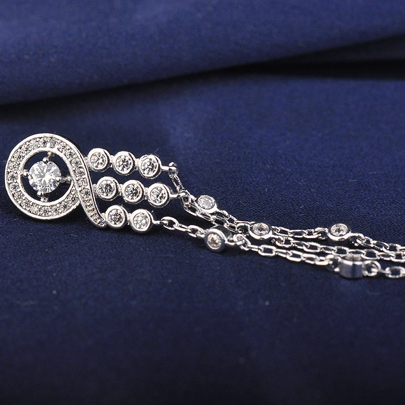 Женские серьги гвоздики серебристого цвета с кисточками и фианитами|luxury stud