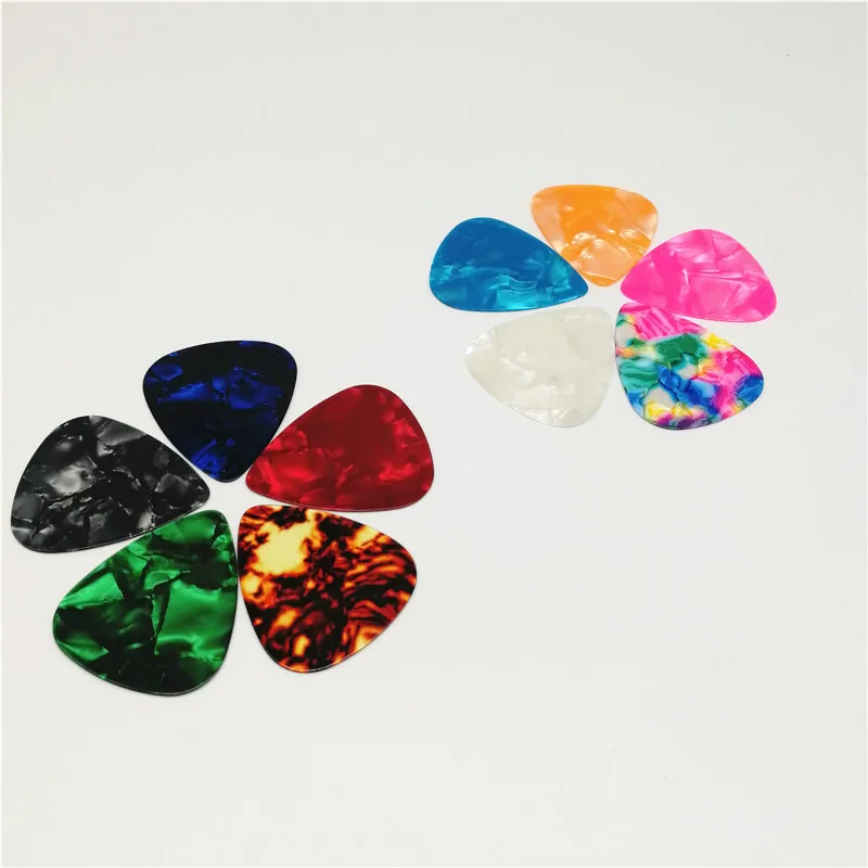 

Chinese Factory Bulk Celluloid Guitar Picks Random Thickness 0.46mm/0.71MM/1.0mm Gauge Mixing 100pcs/lot