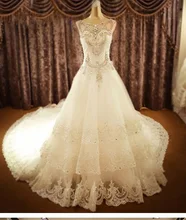 Luxury Royal Wedding Dress Sleeveless O-neck Ball Gown Vestido De Noiva Tiered Beading Crystal Cathedral Train NM 630