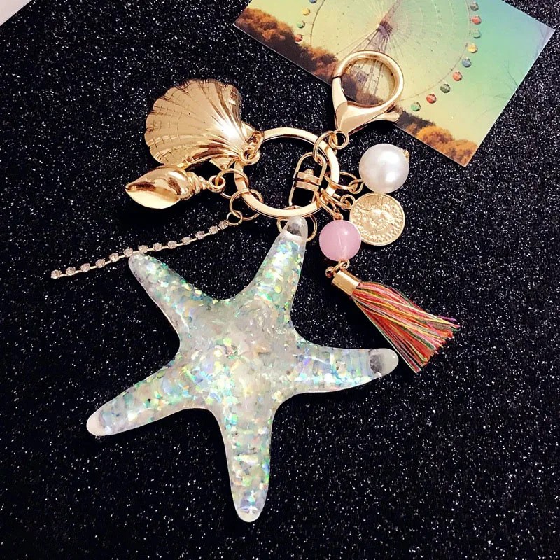 

RE 2018 Cute Cartoon Starfish Shell Key chain Women Crystal Tassel Car Keychain Bag Charms Trinket Key rings Sea World key J1740