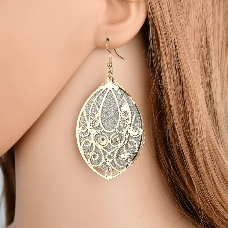 

The new retro palace style multi-layered hollow earrings Ms. exaggerated frosted earrings
