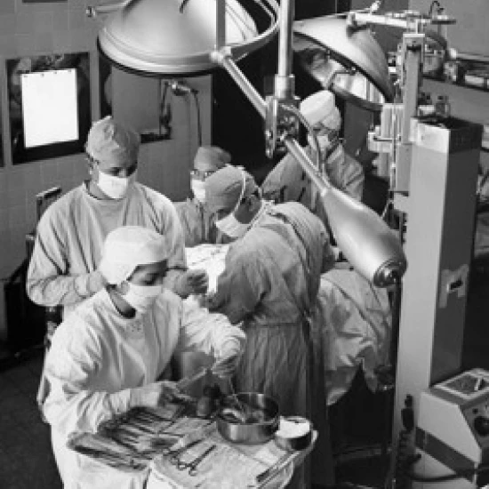 High angle view of surgeons performing a surgery in an operating room Poster Print (18 x 24)