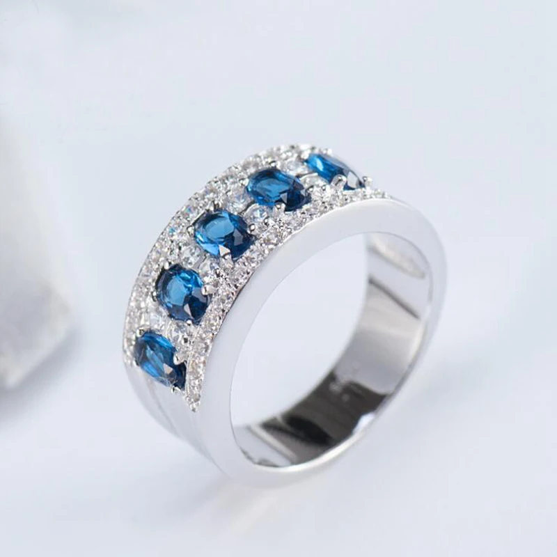 

Ruifan 2018 Lovers Round Rings High Quality Zircon Blue CZ 925 Sterling Silver Engagement wedding Band Ring for Women Men YRI039