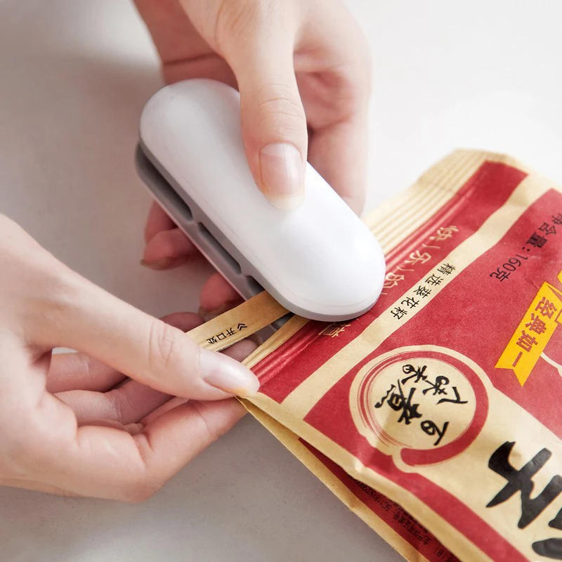 

Mini Package Sealing Machines Portable Bag Clips Hand Pressure Electric Heat Sealing Machine Food Snack Storage Sealing Bag Clip