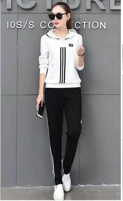 black tracksuit with red and white stripe