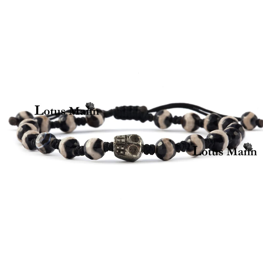 

Lotus Mann A lap black eyes during the day and pyrite skull woven bracelet today