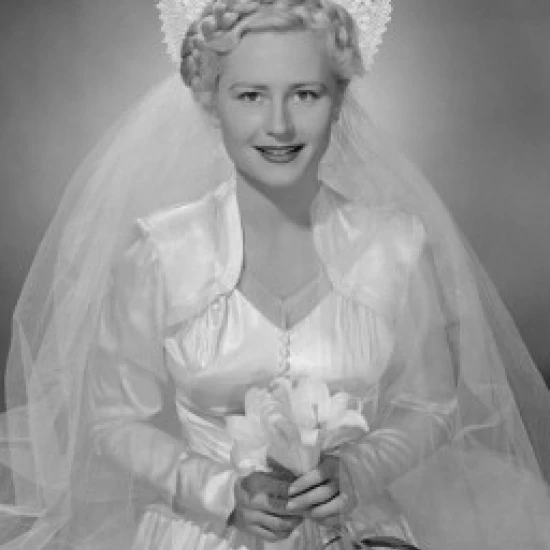 Studio portrait of bride holding flowers Poster Print (18 x 24)