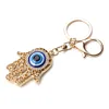 Fashion Gold Color Hollow Out Hamsa Hand Key Chain Turkish Evil Eye Crystal Fatima Palm Key Ring ► Photo 2/6