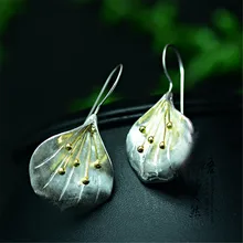 

Brand Thai silver jewelry female long earrings fan-shaped golden flower ear ornaments retro national wind hand simple original