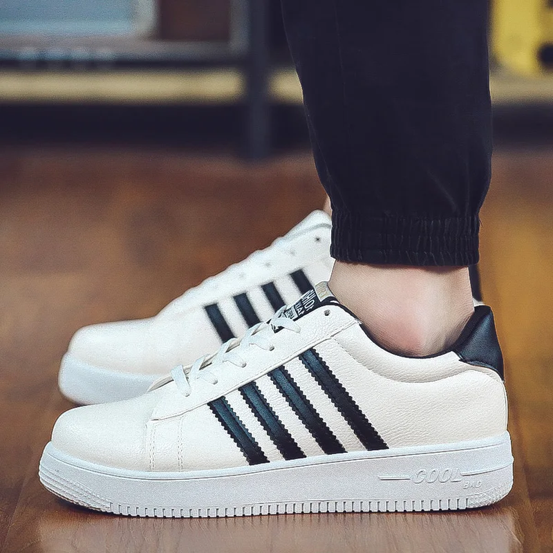 white shoes with 3 black stripes