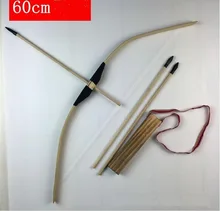 Children outdoors shooting bows and arrows With arrow box