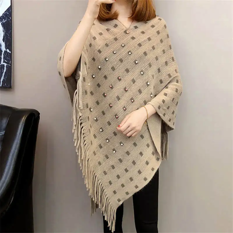 

Autumn and winter knitted tassels in the long section of the shawl new loose cape coat female bat shirt