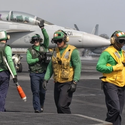 An EA-18G Growler is guided into catapult aboard USS George H.W. Bush Poster Print (20 x 9)
