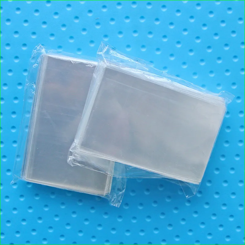 Cartas de jogos de tabuleiro transparentes, manga 45*70mm, para cartas