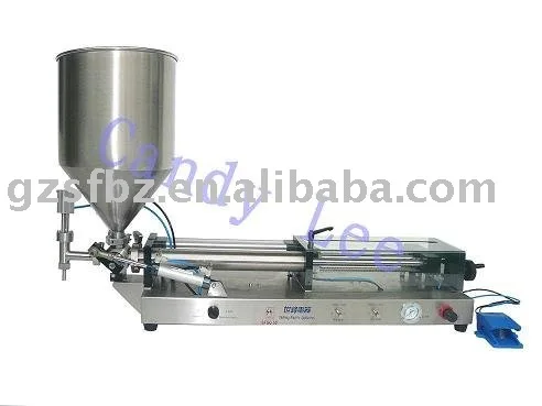 Liquid filler with hopper |