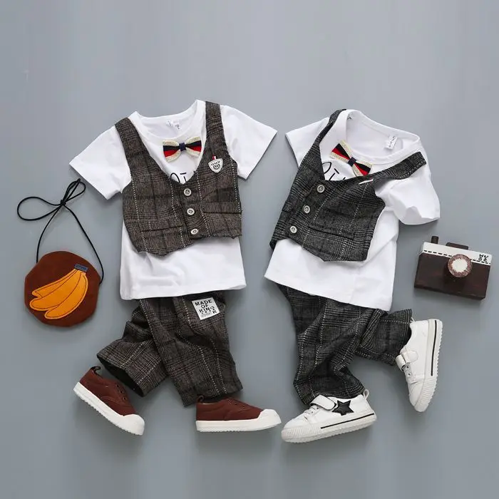 

The new 2018 spring and summer boy tie waistcoat grid a undertakes a three-piece suit