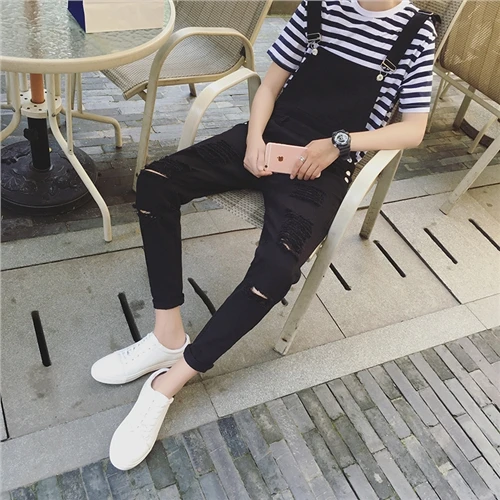 

2019 New Arrival Spring personality big hole ripped jumpsuit Male Suspenders black White Overalls Hip hop Men bib pants 060705