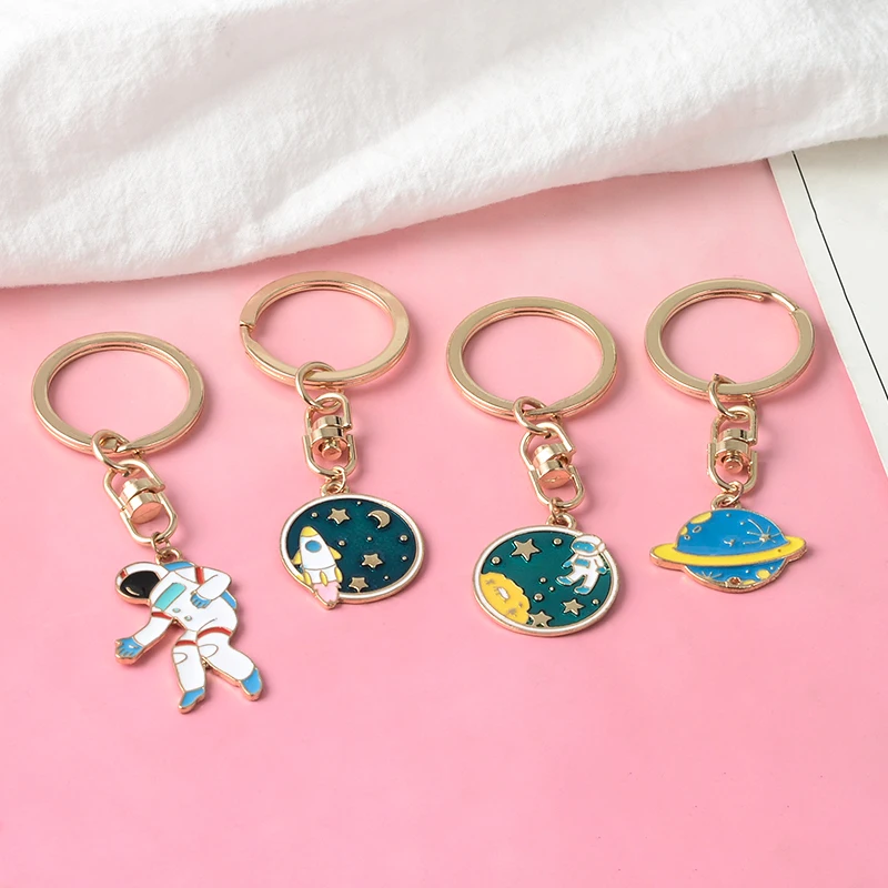 

Escape from the earth ! UFO Space Craft Astronaut Rocket Planet Spaceman Universe Stars Enamel Key Ring KeyChain For astrophile