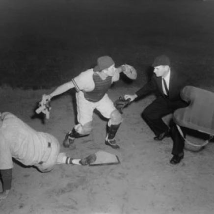 Baseball player sliding on home base and a umpire calling him safe Poster Print (18 x 24)