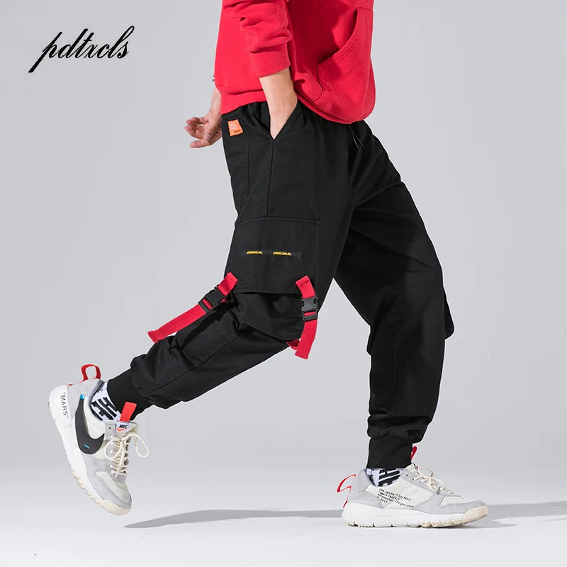 Baratos Nuevo Harajuku algodón Multi bolsillos estilo Safari pantalones cargo de moda hombres otoño Hip Hop Streetwear Casual pantalones elásticos Camo
