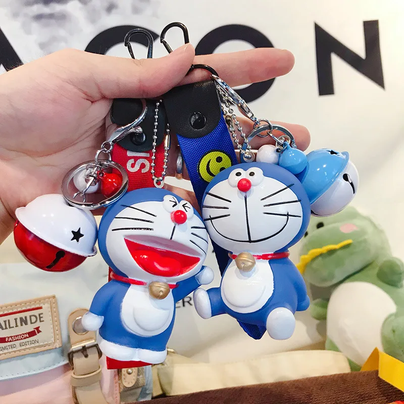 

Cute Cartoon PVC Doraemon Keychain Wristband Bell Car key chain For Women Bag Charm Keyring Jewelry kid toys Party