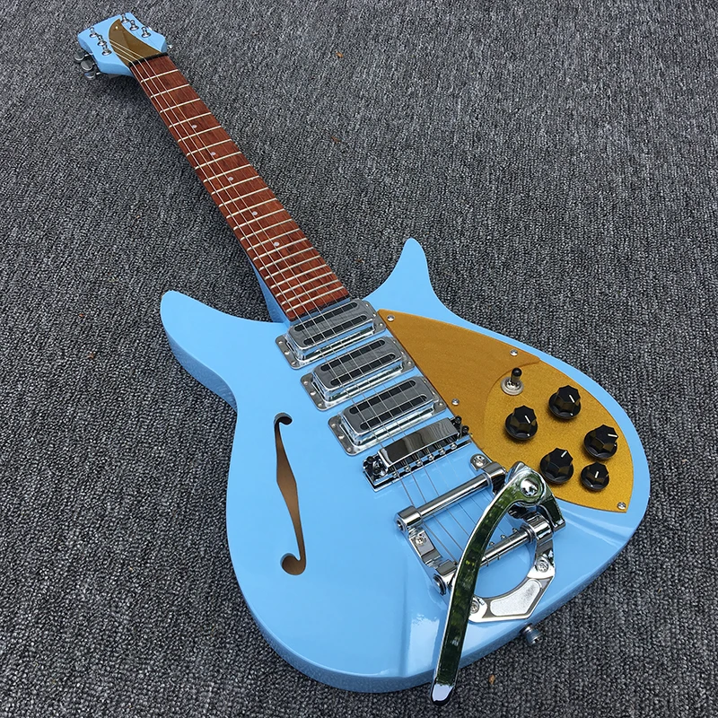 

High quality Three pickup 325 electric guitar,The fingerboard has varnish on it, half-hollow light blue body has a F hole in it.