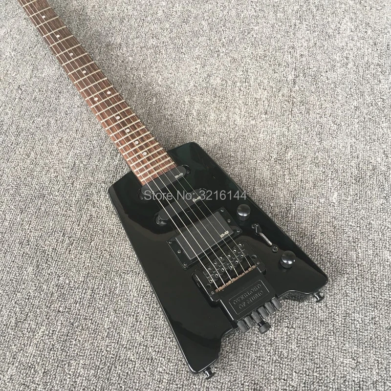 

Travel the new black headless electric guitar, electric guitar, factory wholesale, all colors can be, it can customize according