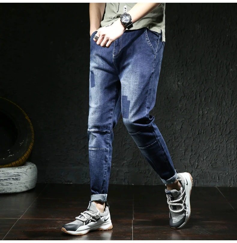 Большие размеры джинсы мужские Весна новые мужские модные рваные зауженные джинсы эластичные повседневные брюки брендовая одежда синий черный