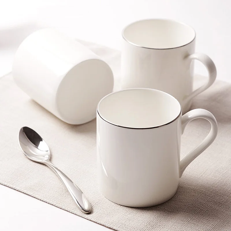 

High Quality bone china ceramic brief with spoon handgrip white breakfast milk tea coffe mugs and cups luxury decorative cups