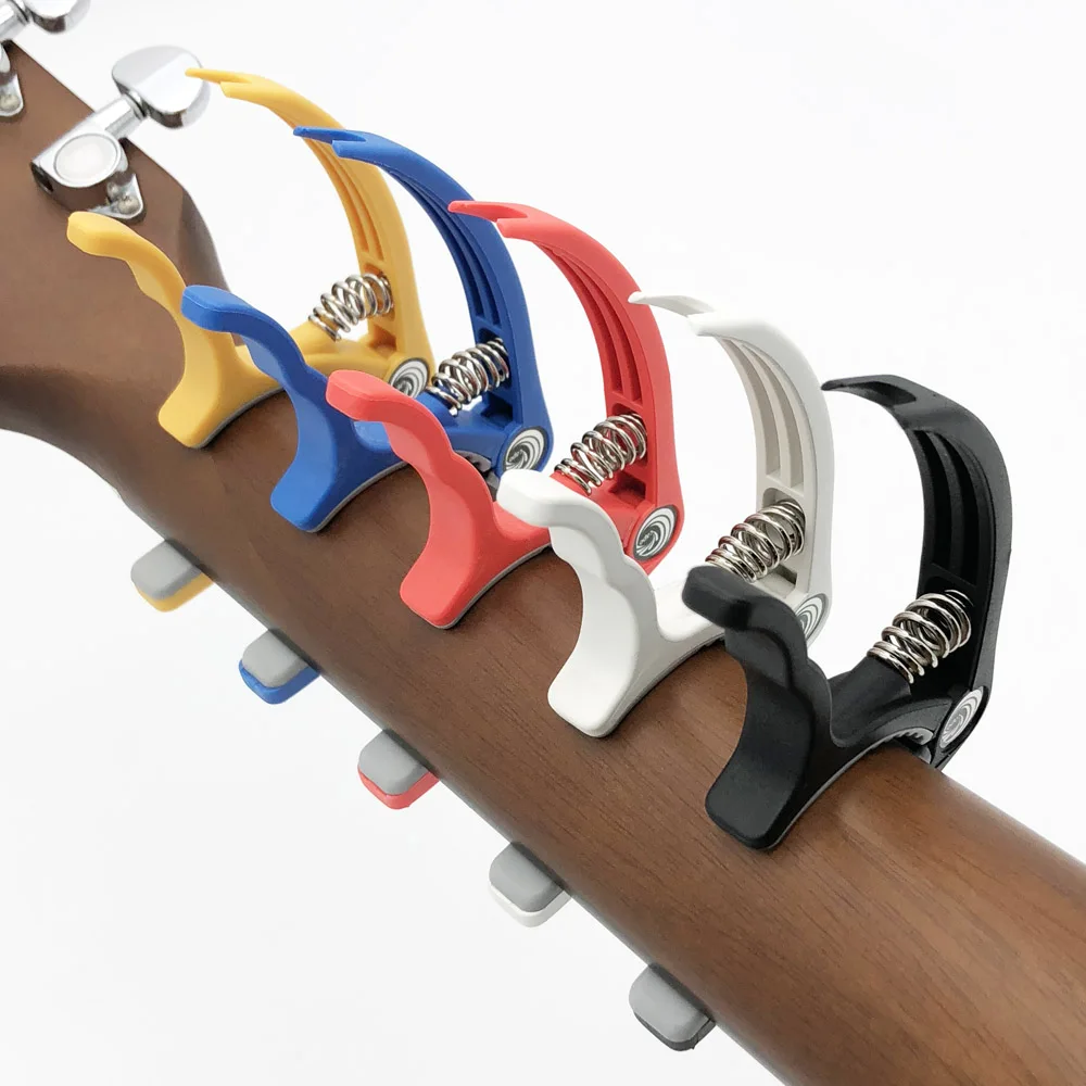 SLOZZ Guitarra de plástico de Capo 6 cuerdas eléctrica acústica Guitarra Bass Ukulele de abrazadera Capotraste Violao Accesorios SLOZZ Guitarra de plástico de Capo 6 cuerdas eléctrica acústica Guitarra Bass Ukulele de abrazadera Capotraste Violao Accesorios