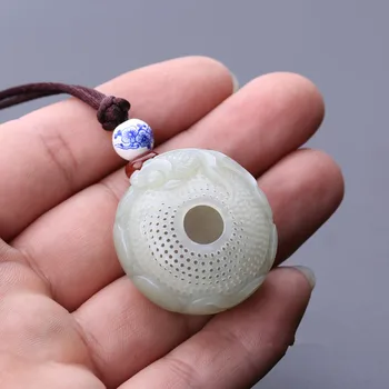 

Natural Hetian stone fish basket, pendant, white stone hollowed goldfish sachet Pendan/1